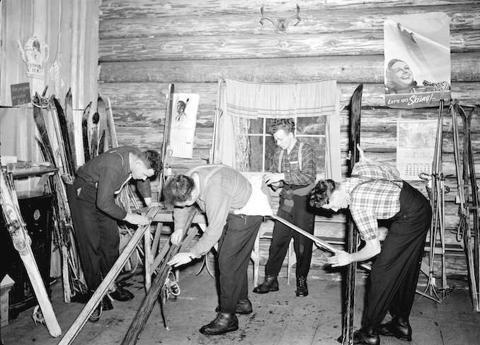 1940-Skiers waxing skis in Enquist LodgeMtSeymour