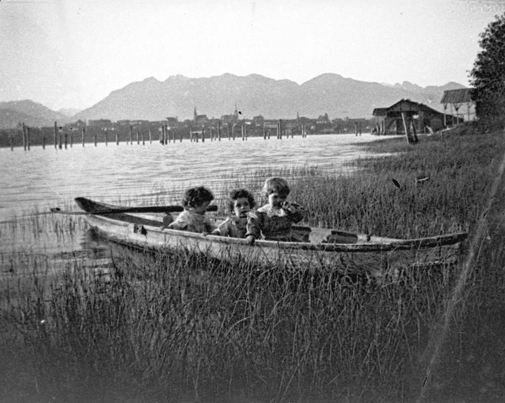 1902-Photograph shows Major J.S. Matthews' three children in a small boat on False Creek, with the Leamy and Kyle Sawmill in the background. J.S. Matthews' notes with print or negative in Archives.