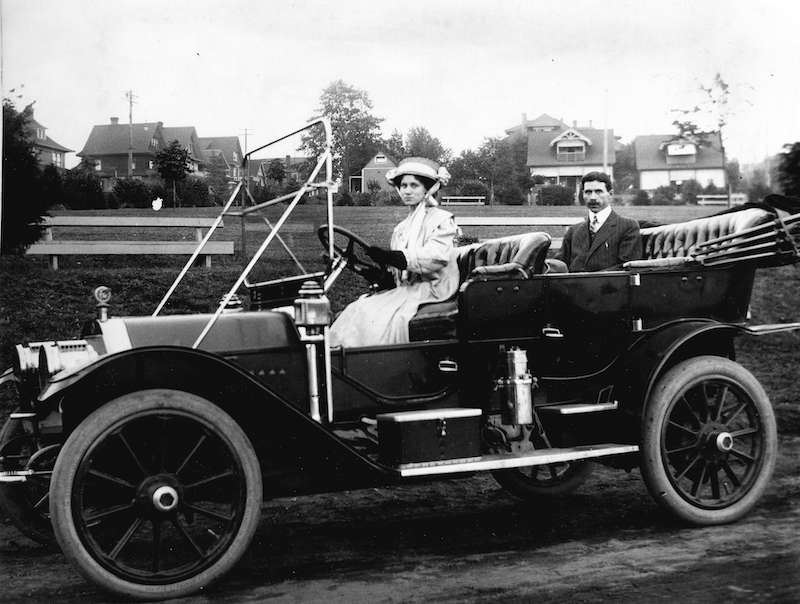 1910-A woman driving a car