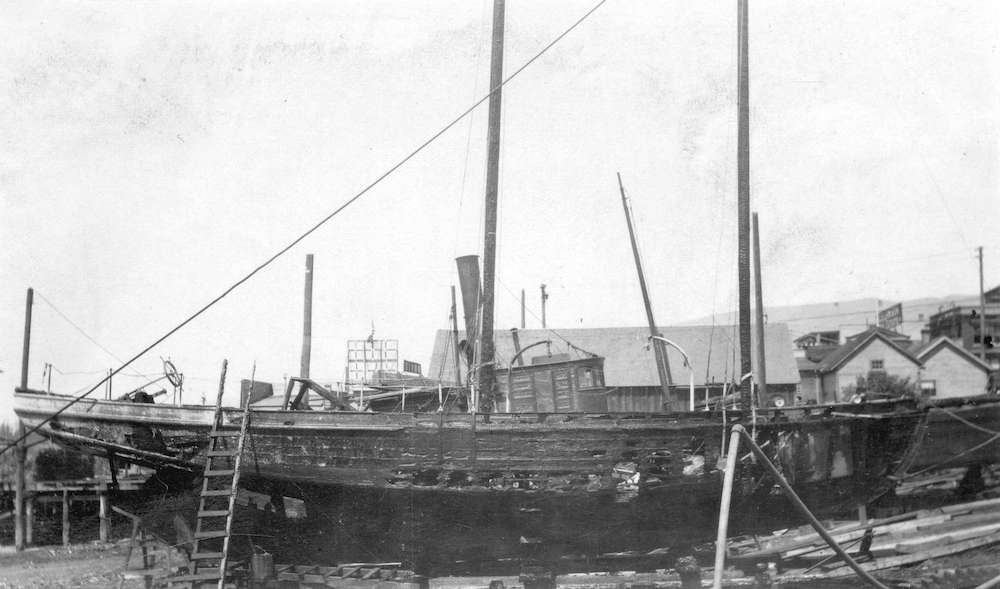1911-A boat burned during the fire at Wallace Shipyards