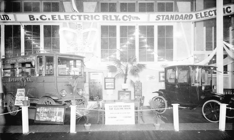 1913-Display of B.C. Electric Railway Company's electric vehicles, including an electric car and an electric bus used by the Lotus Hotel to meet incoming trains and boats