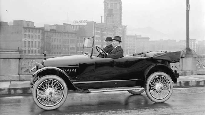 1915-Car on Georgia Viaduct, Sun Tower in background