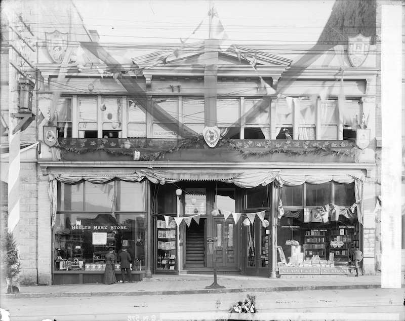 1901-Exterior of Boult's Music Store and N. Caple and Co. Stationers, decorated for the visit of the Duke and Duchess of Cornwall and York