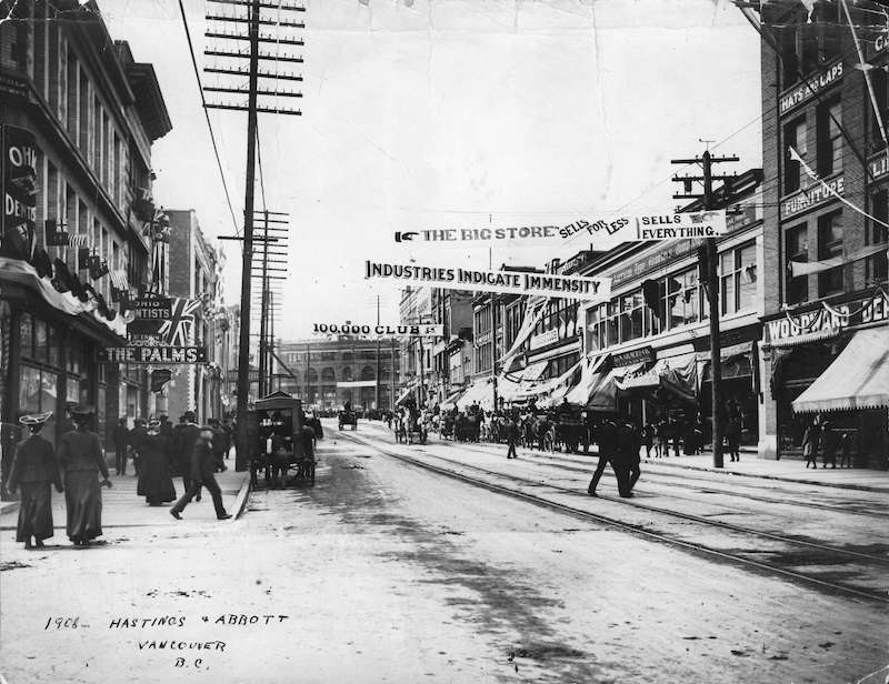 1908-Banner across street at] Hastings and Abbott, Vancouver, B.C.