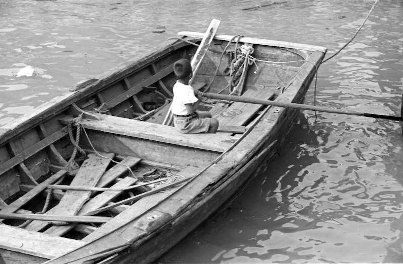 1938 - A boy rowing a boat