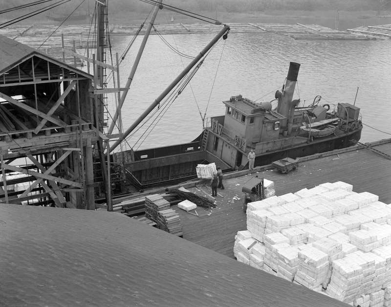 1948 - [Boat being loaded with paper products at the Westminster Paper Company dock]