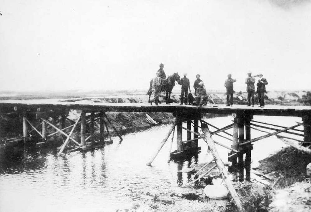 1920 - A wooden bridge over a slough at Jericho Beach
