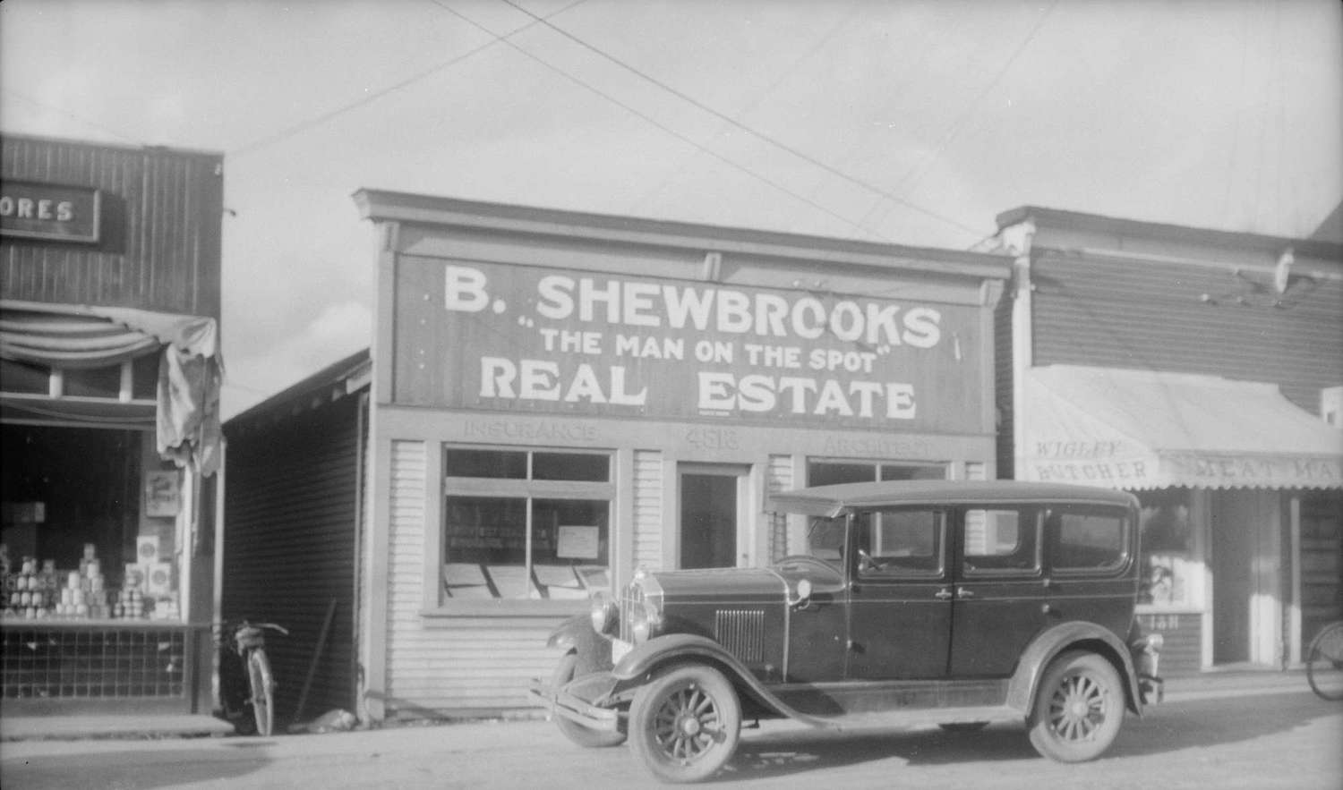 1920 - Storefront of B. Shewbrooks The Man on the Spot Real Estate, Insurance, Architect
