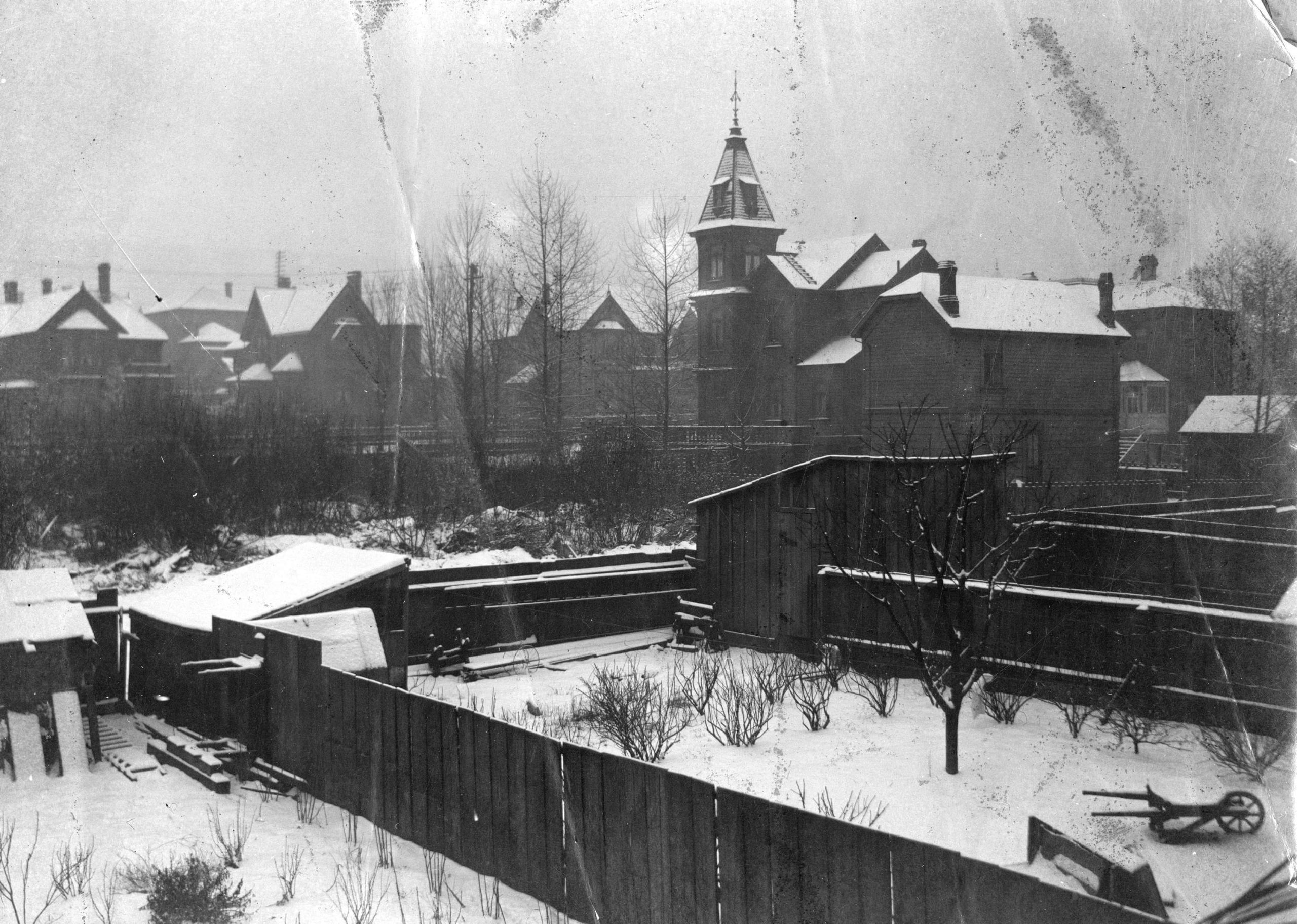 1896 - View across a backyard towards Burrard Street and Melville Street