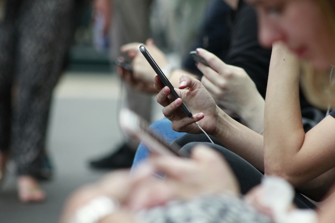 cell phone users on train