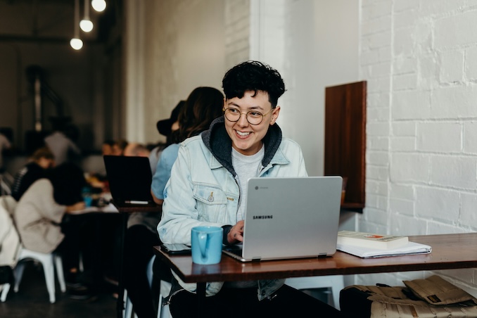 using a computer in a coffeeshop