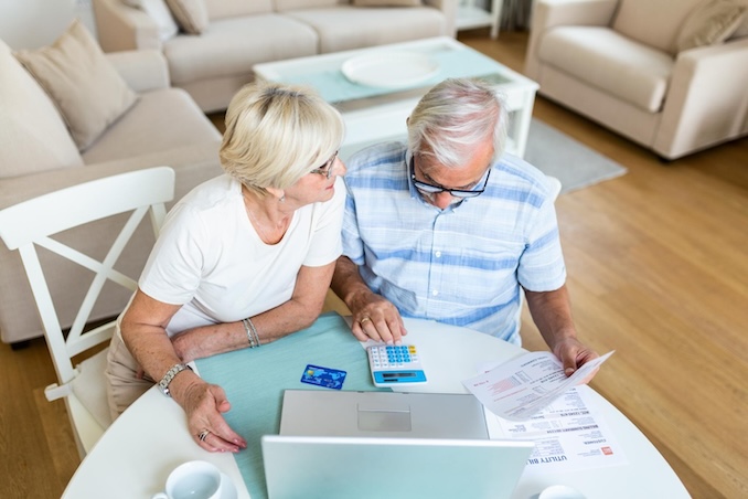 elderly couple on the computer