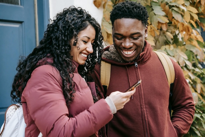 couple looking at their cell phone together