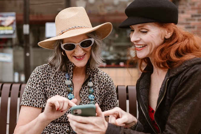 friends on cell phone playing a game