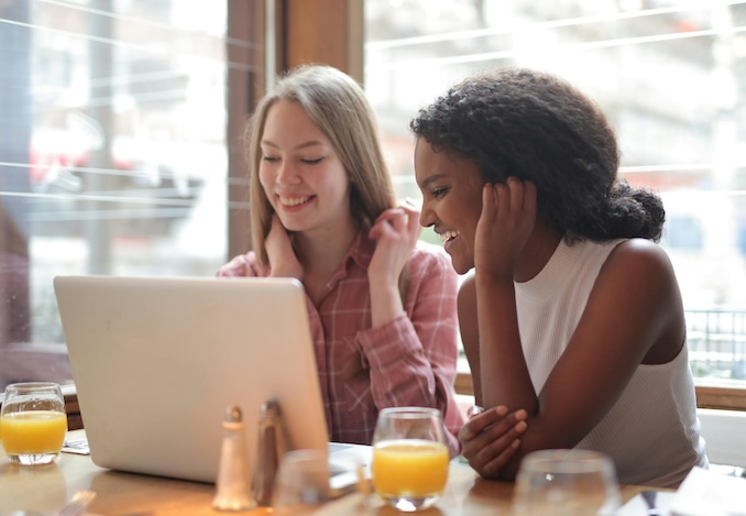 women watching a laptop at home